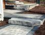 Paver walkway and stone steps leading up 