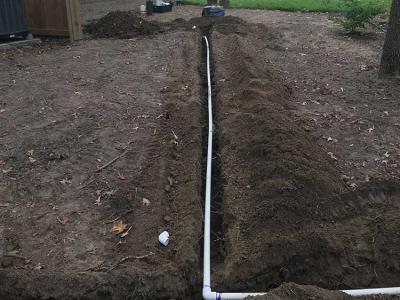 trenched irrigation line in dark soil